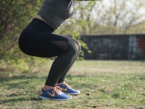 Girl doing squats outdoor